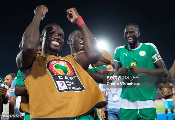 Sadio Mané and Cheikhou Kouyate of Senegal celebrate victory after winning the 2019 Africa Cup of Nations Semi Final match between Senegal and...