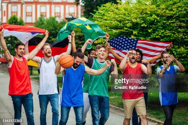 basketball fans shouting on the street - serbian flag stock pictures, royalty-free photos & images