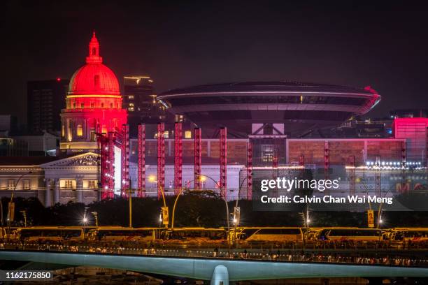 night view of national gallery singapore - singapore national flag stock pictures, royalty-free photos & images