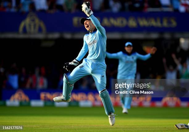 Jos Buttler of England celebrates as he runs out Martin Guptill of New Zealand during the Final of the ICC Cricket World Cup 2019 between New Zealand...