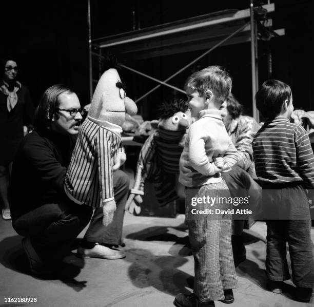 Puppeteers Frank Oz holding Bert and Jim Henson holding Ernie during rehearsals for an episode of Sesame Street at Reeves TeleTape Studio in March,...