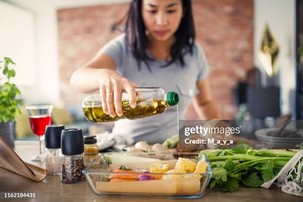 making healthy meal - oil bottle stock pictures, royalty-free photos & images