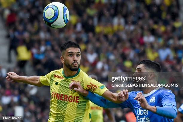 Nantes' French midfielder Imran Louza vies for the ball with Marseille's Spanish defender Alvaro Gonzales during the French L1 football match between...