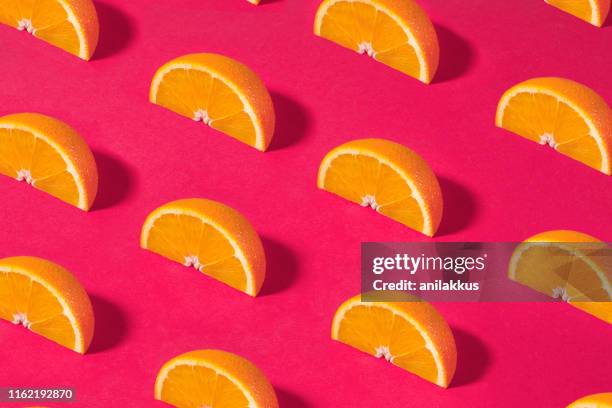 orange fruit pattern on pink background - fruit pattern stock pictures, royalty-free photos & images