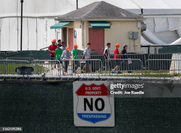 Young people walk the grounds of the Homestead Temporary Shelter for Unaccompanied Children as congress members including Rep. Rosa DeLauro , Chair...