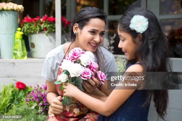 florist giving rose flower to girl - asia lady selling flower stock pictures, royalty-free photos & images