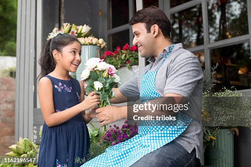 Giving Out Roses Florist Giving Rose Flower To Girl High-Res Stock Photo - Getty Images