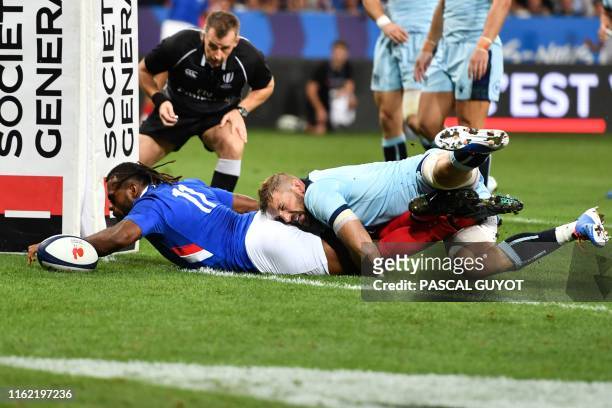 France's winger Alivereti Raka dives across the line to score a try during the 2019 Rugby World Cup warm-up test match between France and Scotland,...