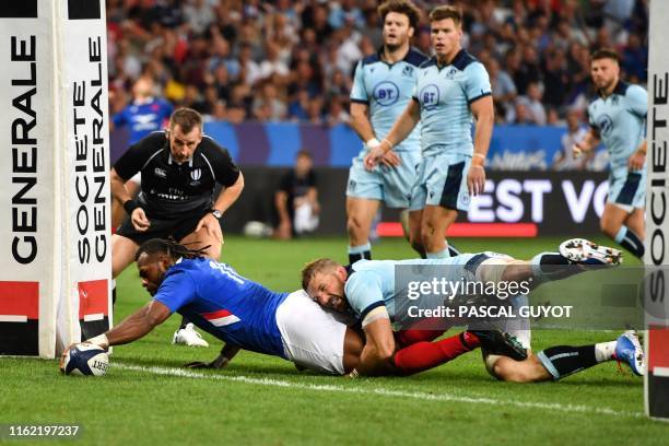 France's winger Alivereti Raka dives across the line to score a try during the 2019 Rugby World Cup warm-up test match between France and Scotland,...