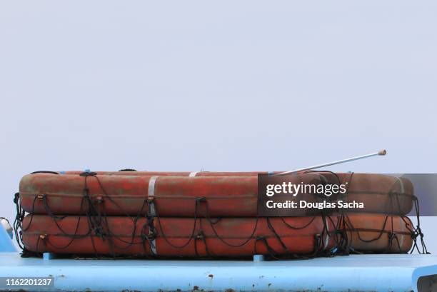 emergency life raft stacked on a nautical boat - lifeboat stock pictures, royalty-free photos & images