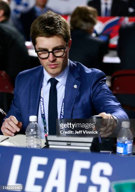 General manager Kyle Dubas of the Toronto Maple Leafs puts the phone down during the first round of the 2019 NHL Draft at Rogers Arena on June 21,...