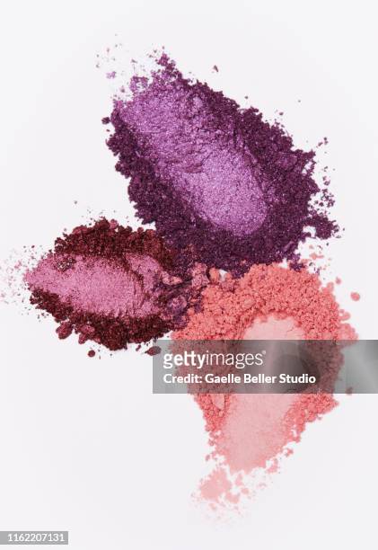 crushed multi colored eyeshadows with finger imprints - eyeshadow stock-fotos und bilder