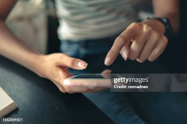 hand holding smartphone device.social media on mobile phone. - email marketing stock pictures, royalty-free photos & images