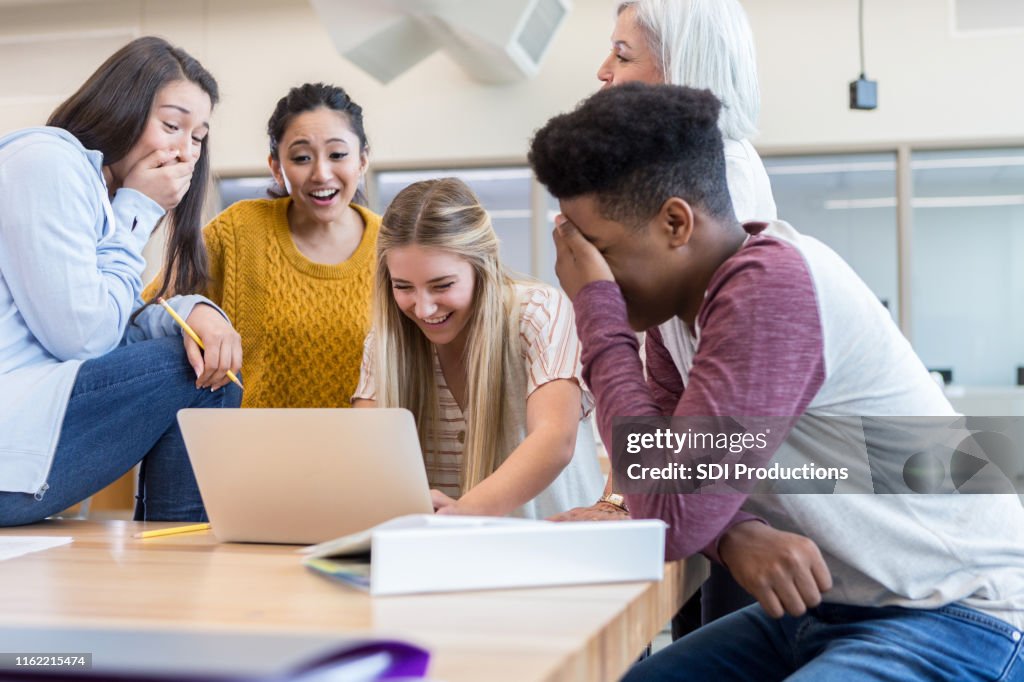Embarrass Friend Embarrassed Teenage Boy Hides Face While Friends Watch His Video High ...