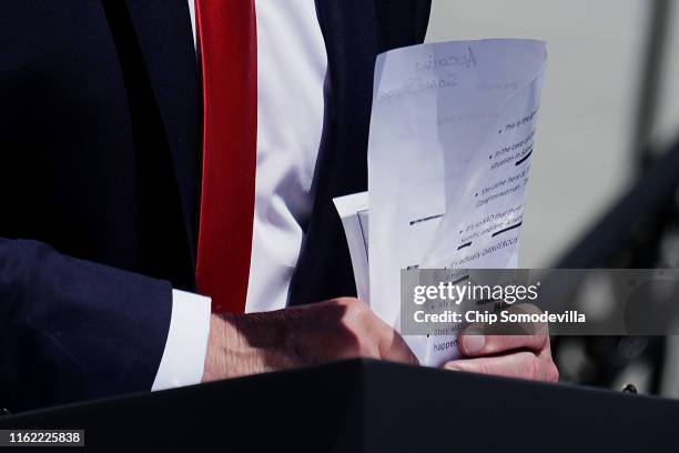 President Donald Trump puts away his notes after addressing his Made In America product showcase at the White House July 15, 2019 in Washington, DC....