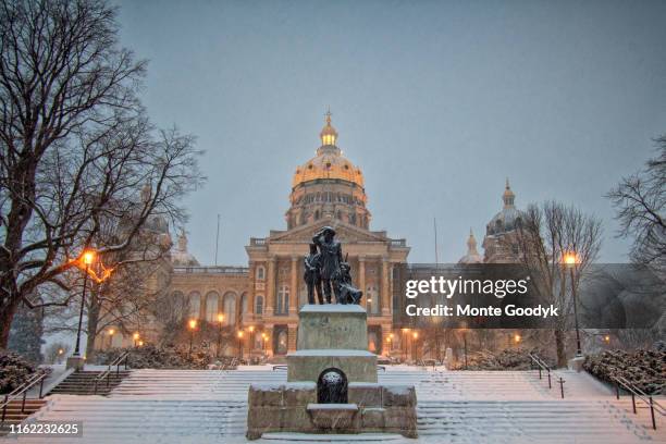 iowa capitol in evening snowfall - des moines iowa stock pictures, royalty-free photos & images