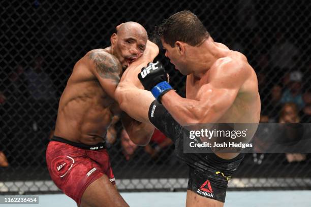 Paulo Costa of Brazil kicks Yoel Romero of Cuba in their middleweight bout during the UFC 241 event at the Honda Center on August 17, 2019 in...