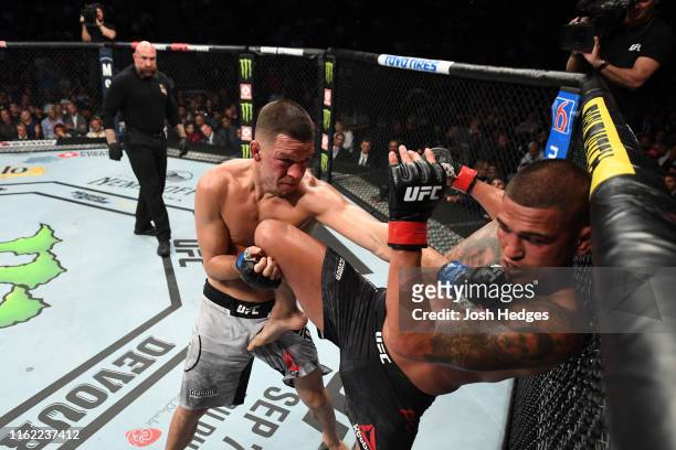 Nate Diaz punches Anthony Pettis in their welterweight bout during the UFC 241 event at the Honda Center on August 17, 2019 in Anaheim, California.