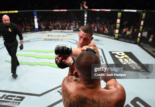 Nate Diaz punches Anthony Pettis in their welterweight bout during the UFC 241 event at the Honda Center on August 17, 2019 in Anaheim, California.