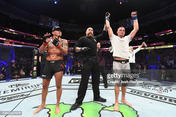 Nate Diaz celebrates his victory over Anthony Pettis in their welterweight bout during the UFC 241 event at the Honda Center on August 17, 2019 in...