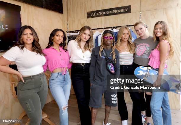 Denise Bidot, Corrine Foxx, Kathryn Gallaghar, Lil Wayne, Sailor Brinkley Cook, Ireland Baldwin, and Nina Agdal attend the AE x Young Money Collab...