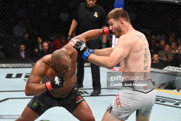 Daniel Cormier punches Stipe Miocic in their heavyweight championship bout during the UFC 241 event at the Honda Center on August 17, 2019 in...