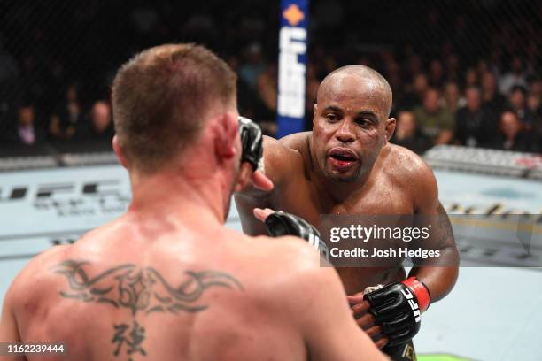 Daniel Cormier punches Stipe Miocic in their heavyweight championship bout during the UFC 241 event at the Honda Center on August 17, 2019 in...