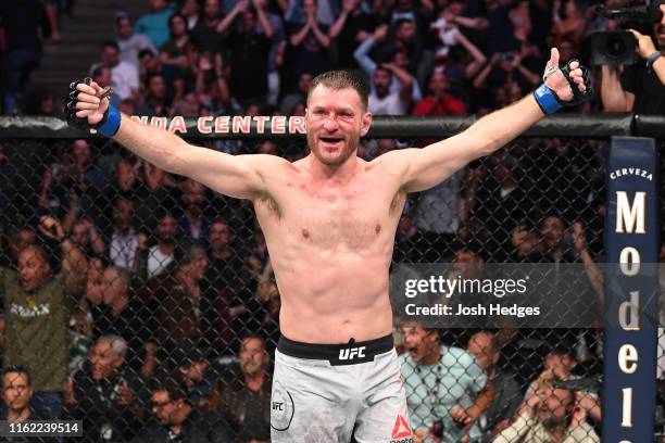 Stipe Miocic celebrates his TKO victory over Daniel Cormier in their heavyweight championship bout during the UFC 241 event at the Honda Center on...