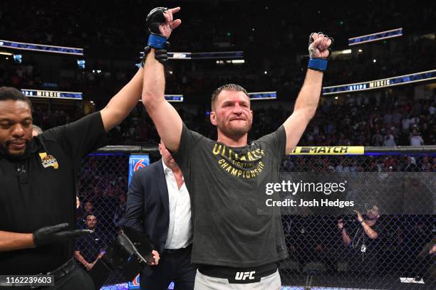 Stipe Miocic celebrates his TKO victory over Daniel Cormier in their heavyweight championship bout during the UFC 241 event at the Honda Center on...