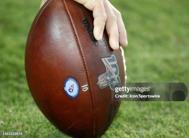 An NFL football with the NFL 100 logo during a preseason game between the Tennessee Titans and New England Patriots on August 17 at Nissan Stadium in...