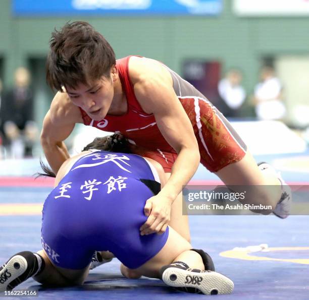 Kaori Icho and Sae Nanjo compete in the Women's 57kg semi final on day three of the All Japan Wrestling Invitational Championships at Komazawa...