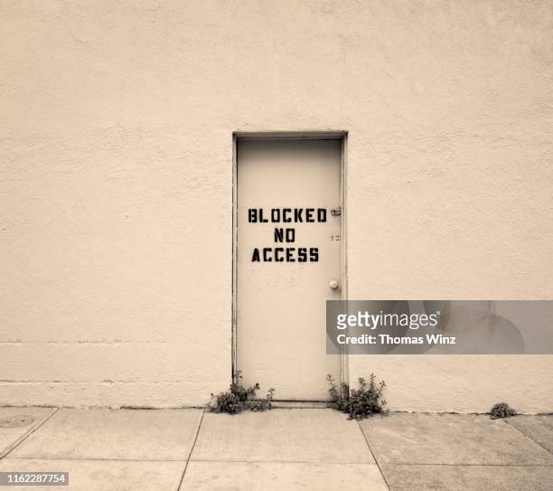 door with no access - exclusion concept stock pictures, royalty-free photos & images