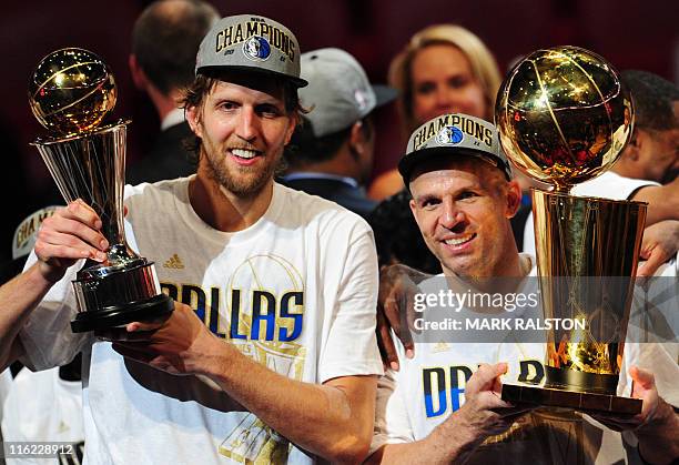 Dirk Nowitzki and Jason Kidd of the Dallas Mavericks hold the MVP and Larry O'Brien Trophies after defeating the Miami Heat in Game Six of the 2011...