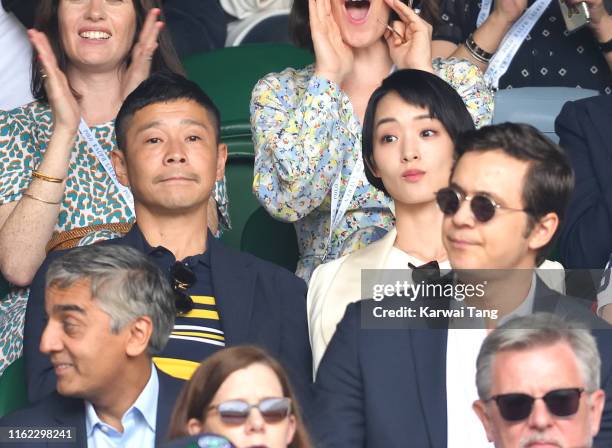 Yusaku Maezawa and Ayame Goriki on Centre Court on Men's Finals Day of the Wimbledon Tennis Championships at All England Lawn Tennis and Croquet Club...