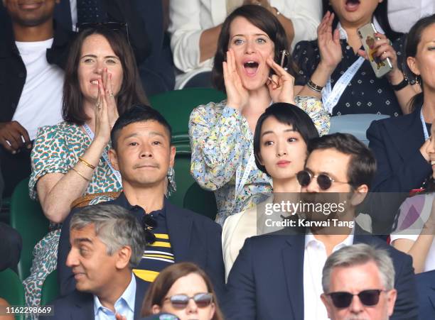 Claire Foy , Yusaku Maezawa and Ayame Goriki on Centre Court on Men's Finals Day of the Wimbledon Tennis Championships at All England Lawn Tennis and...