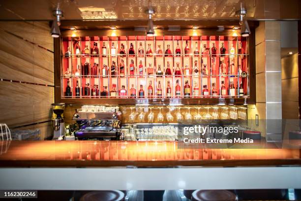 a bar with drinks display in a prestigious restaurant - bar area stock pictures, royalty-free photos & images