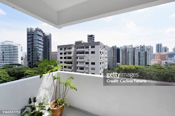 view from an apartment balcony in singapore - balcony view fotografías e imágenes de stock