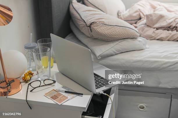 laptop computer in teenager's bedroom - night table stock pictures, royalty-free photos & images