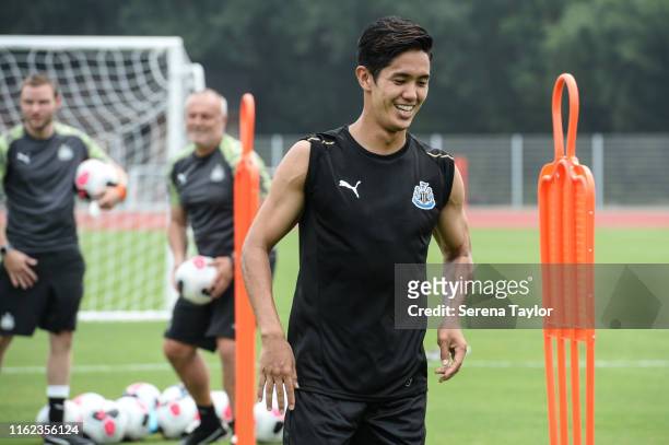 Yoshinori Muto of Newcastle United smiles during the Newcastle United Training session at Nanjing Olympic Sports Center on July 16, 2019 in Nanjing,...