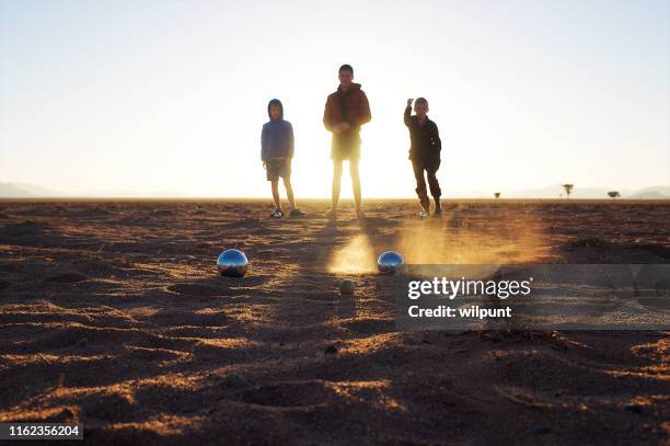 pétanque balls game back bed dust - petanque stock pictures, royalty-free photos & images