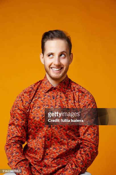 handsome man grimacing and smiling widely - smart studio shot stock pictures, royalty-free photos & images