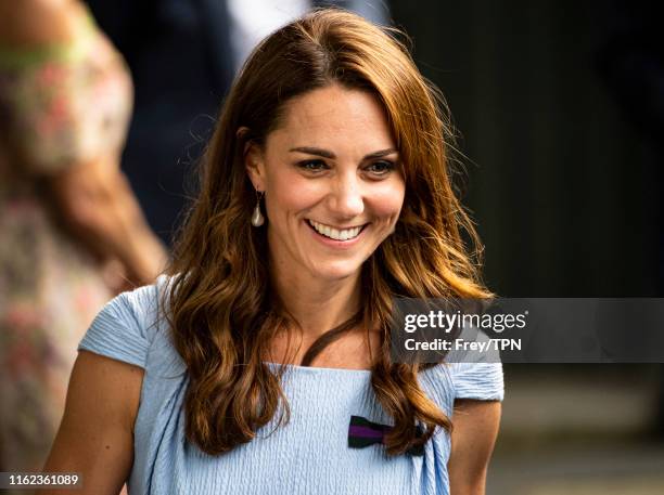 The Duchess of Cambridge leaves Centre Court after the trophy presentation after Novak Djokovic of Serbia's victory over Roger Federer of Switzerland...