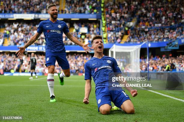 Chelsea's English midfielder Mason Mount celebrates scoring the opening goal with Chelsea's French striker Olivier Giroud during the English Premier...