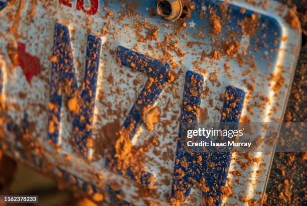 close-up of mud covered license plate - registration plate stock pictures, royalty-free photos & images