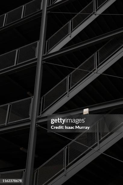 abstract winding modern black staircases - architektur schwarzweiss stock-fotos und bilder