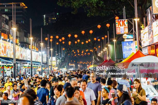 crowds of people in chinatown in kuala lumpur, malaysia - malasia 個照片及圖片檔