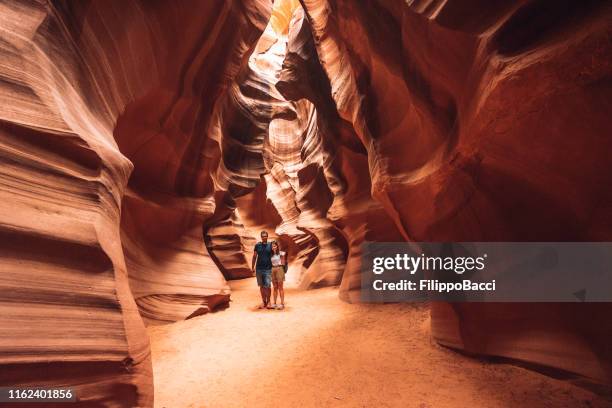 couple portrait inside antelope canyon - surreal desert stock pictures, royalty-free photos & images