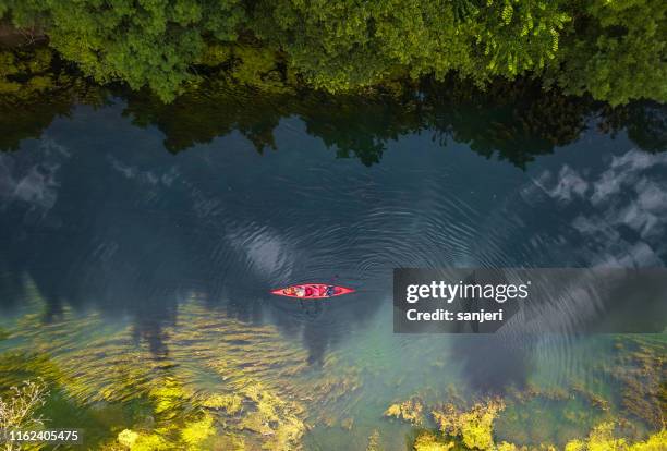 canoeing on the river - canoeing stock pictures, royalty-free photos & images