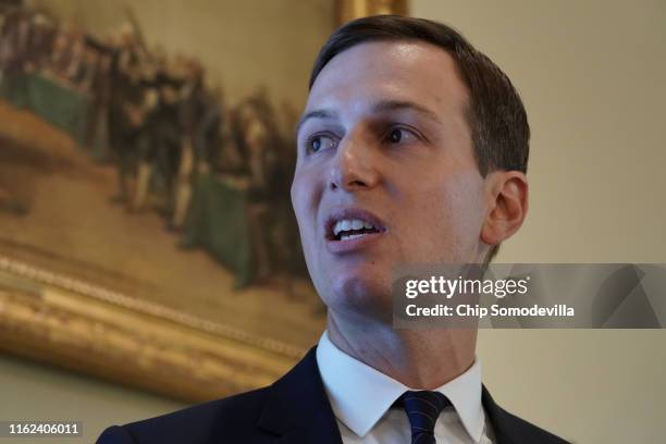 Jared Kushner, senior advisor to his father-in-law U.S. President Donald Trump, makes a presentation about immigration during a cabinet meeting at...