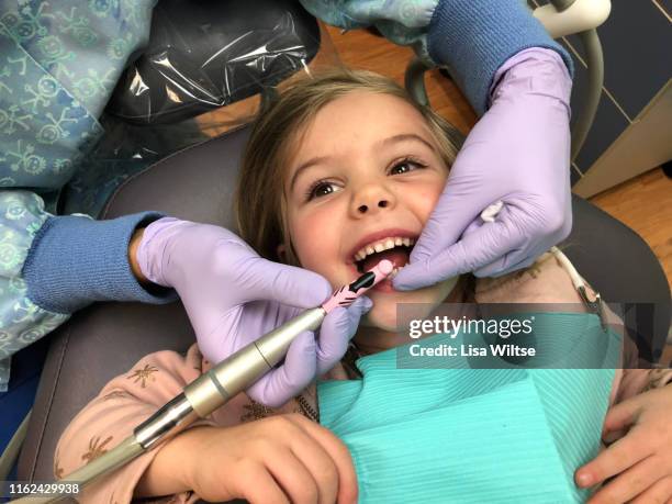 little girl at the dentist - dentist stock pictures, royalty-free photos & images